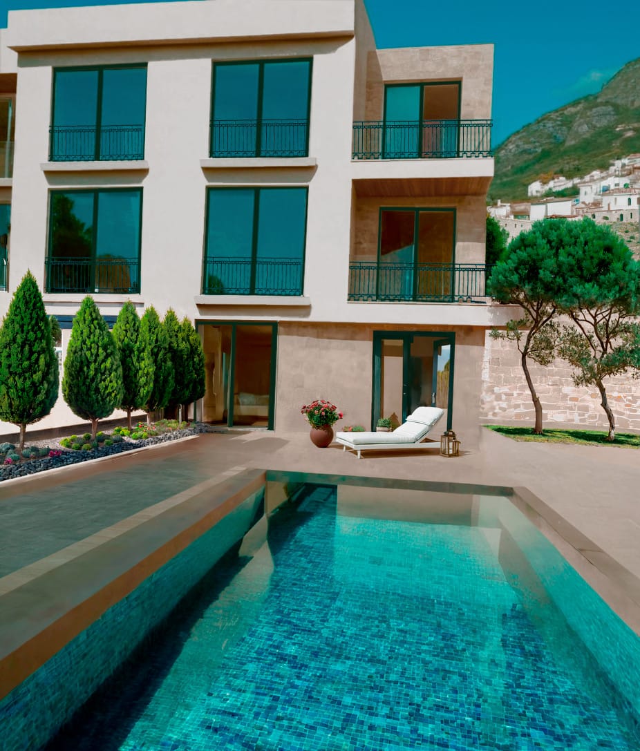 Modern townhouse with a pool and terrace in Blizikuće, Montenegro: view of the facade with panoramic windows and mountains.