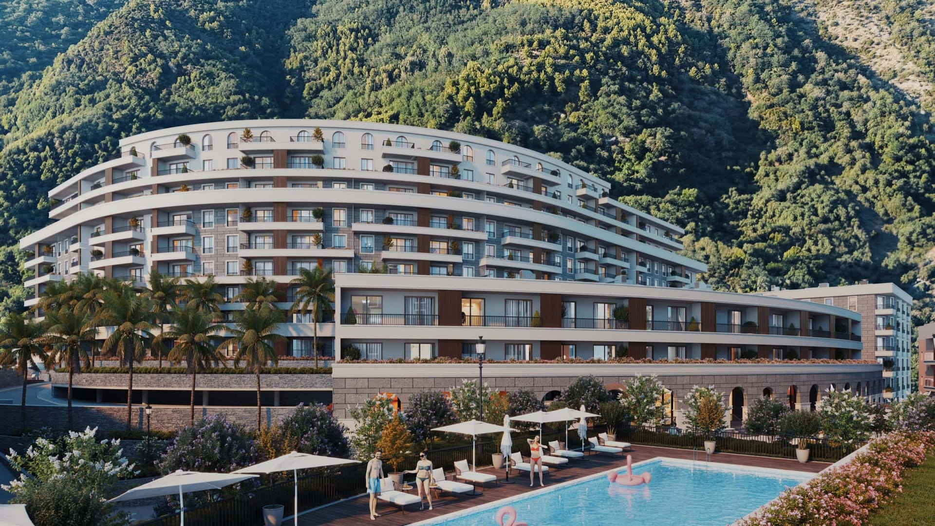 Modern residential complex in Bečići, Montenegro: a multi-story building with a pool, terraces, and mountain views.
