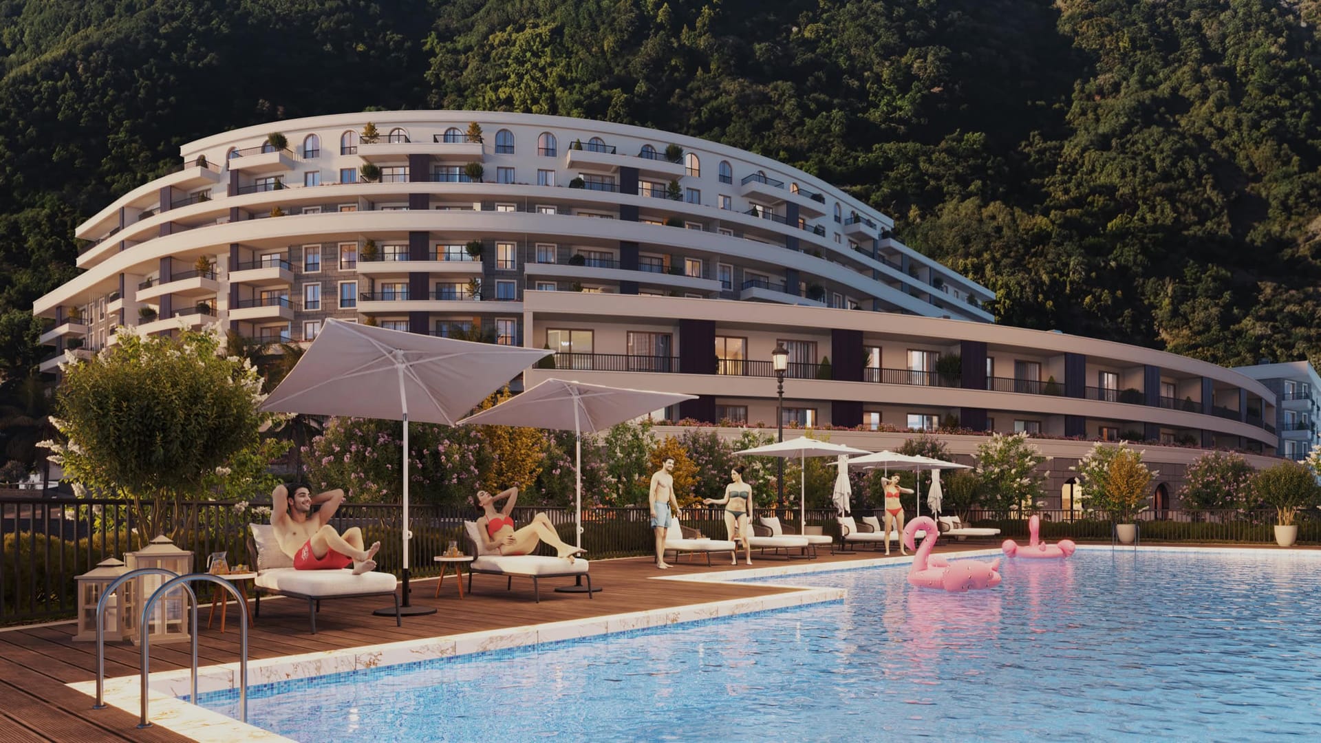Residential complex in Bečići, Montenegro: a modern hotel with an outdoor pool, sun loungers, and mountain views.