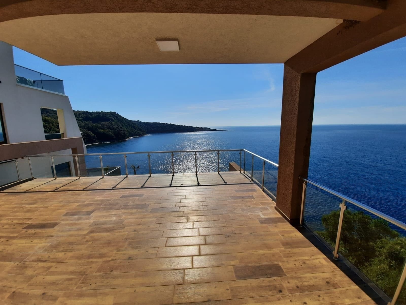 Spacious terrace with panoramic sea and mountain views, villa in Dobra Voda, Kruče, Montenegro, modern finishes.