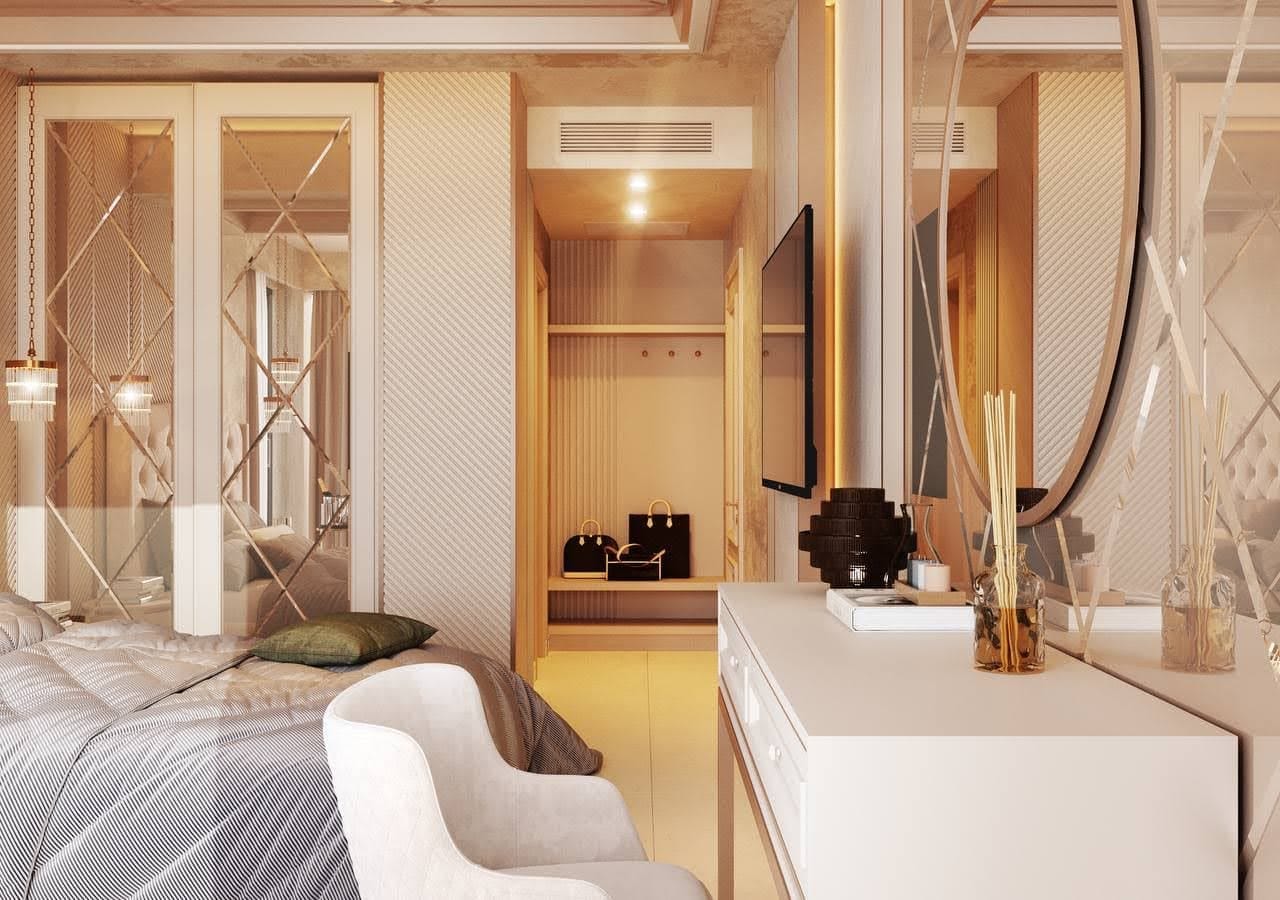 Interior of a modern bedroom in a villa in Petrovac, Montenegro: mirrored wardrobe, vanity table, and walk-in closet area.