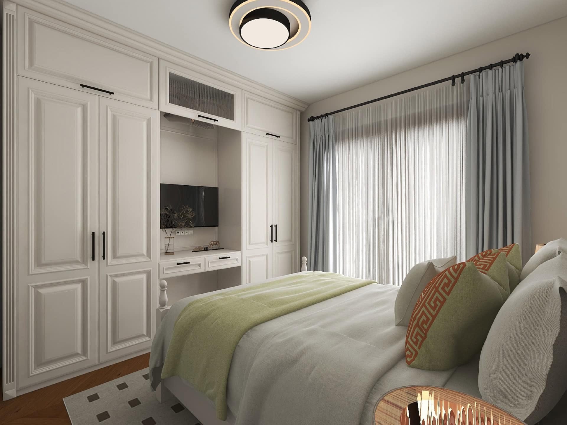 Bedroom in a modern style with a white wardrobe and TV area in the Risan residential complex, Montenegro. Cozy interior with a double bed.