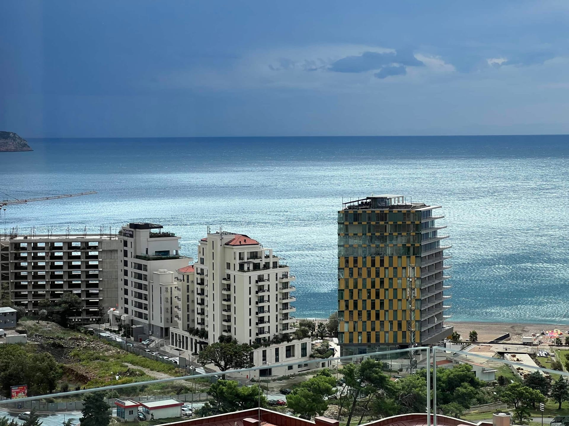 Panoramic view of the sea and modern residential complexes in Bečići, Montenegro, from the balcony of apartment No. 2190.