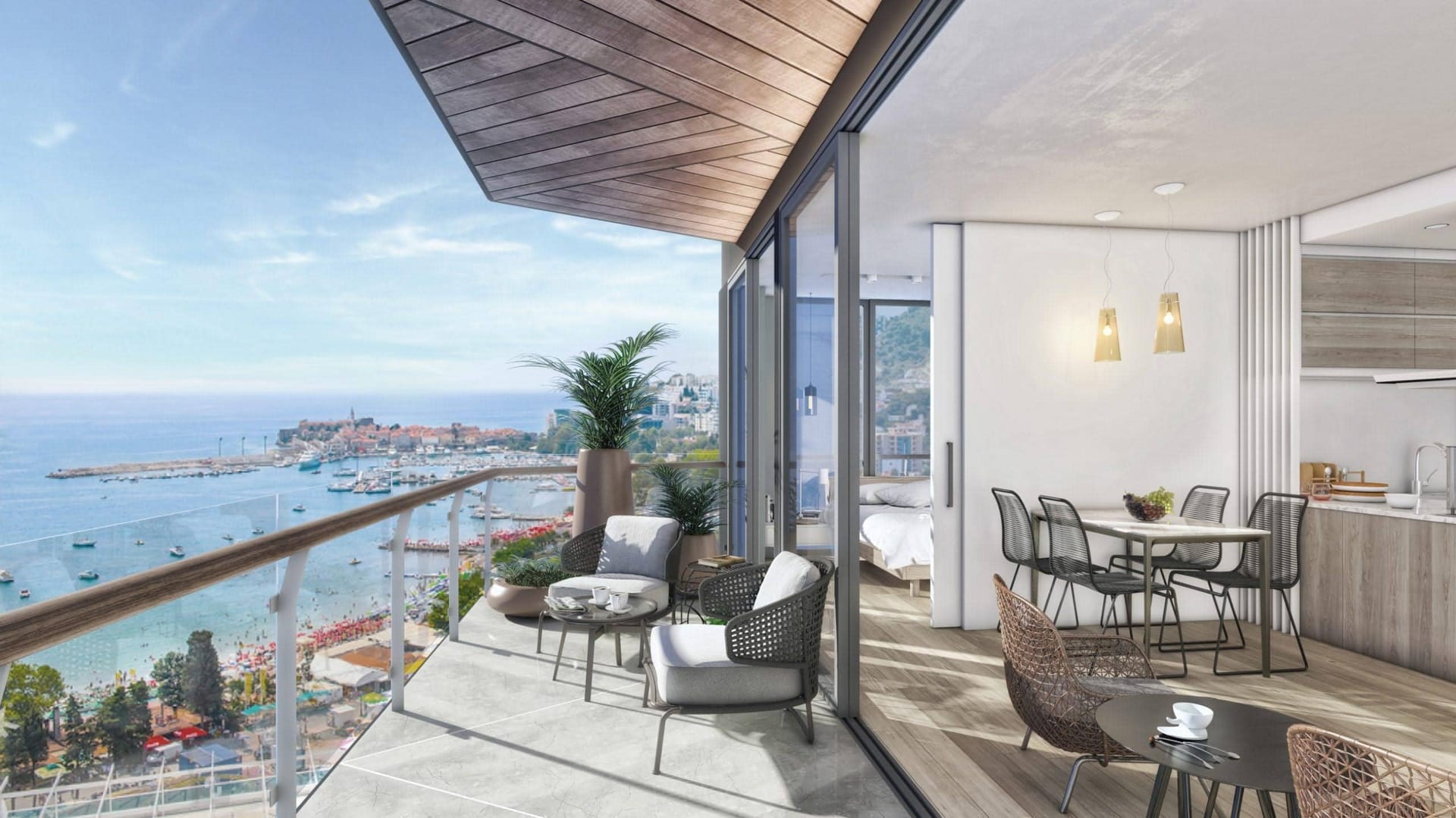 Terrace with sea and Budva views in residential complex No. 2170, Montenegro: wicker furniture, panoramic glazing, and modern design.