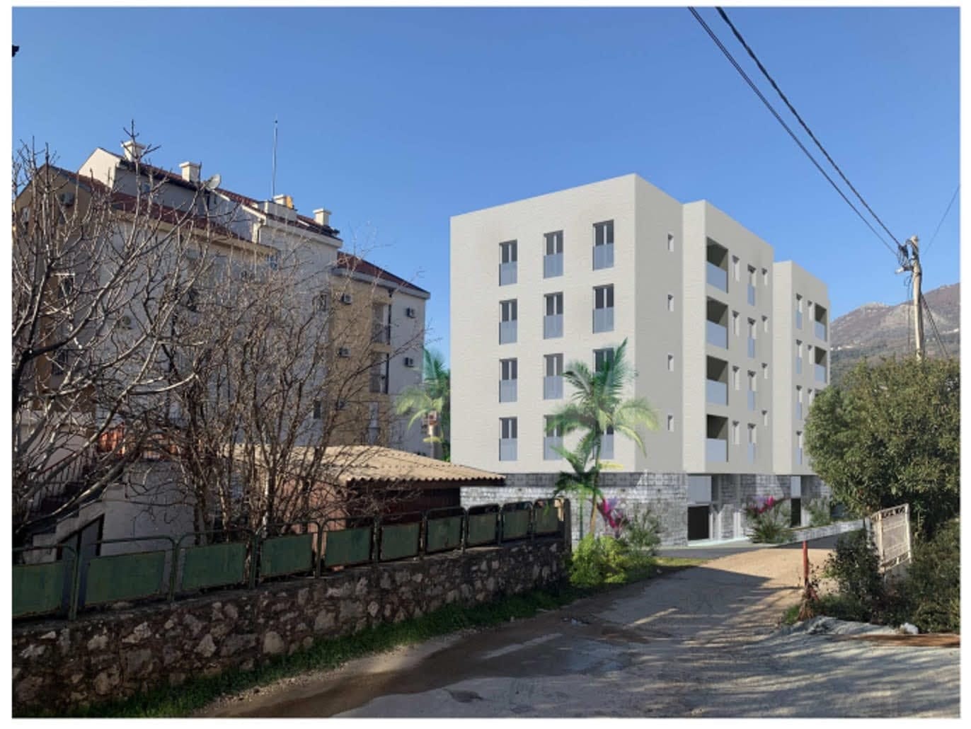 3D visualization of a modern residential complex in Dobra Voda, Montenegro: a four-story building with balconies and parking.