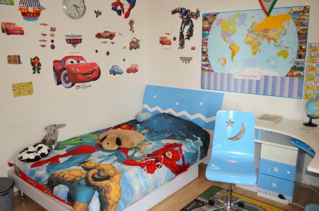 Children's bedroom in an apartment in Bar, Montenegro: bed, desk, and themed wall decor.