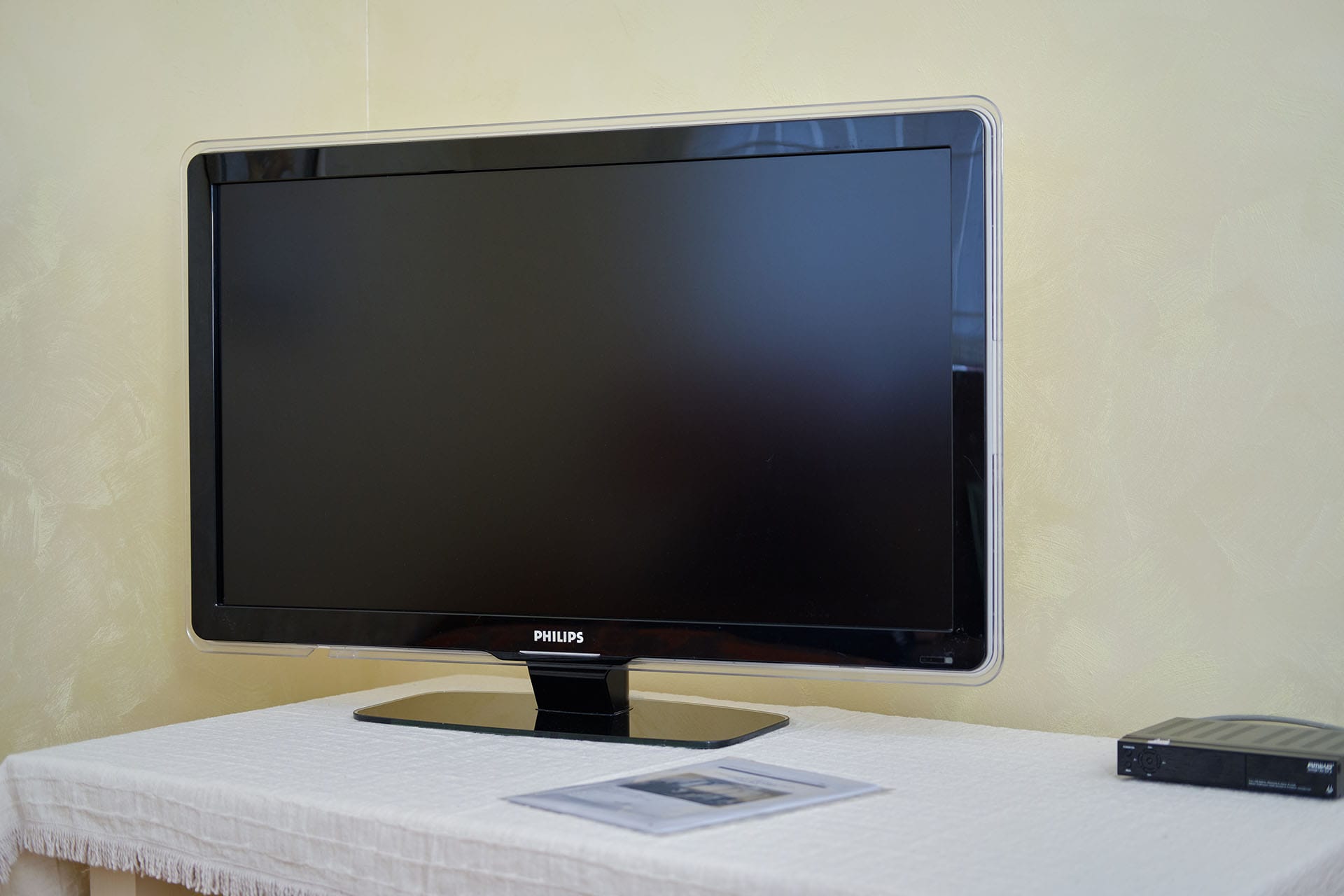 Philips TV in the townhouse living room in Bigovo, Montenegro: light wall finishes and a cozy home atmosphere.