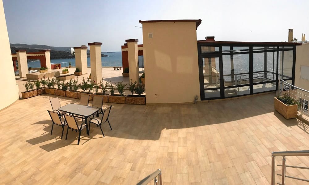Spacious terrace with furniture and panoramic sea view in an apartment, Dobrota, Montenegro.