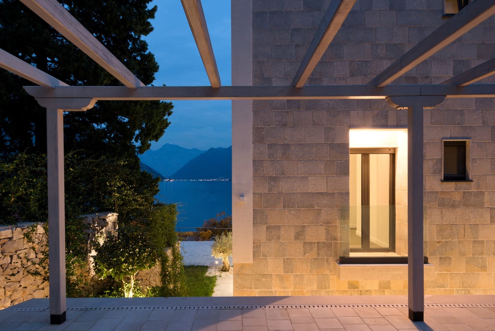 Stone villa in Strp, Montenegro: view from the pergola terrace of the sea and mountains in the evening.