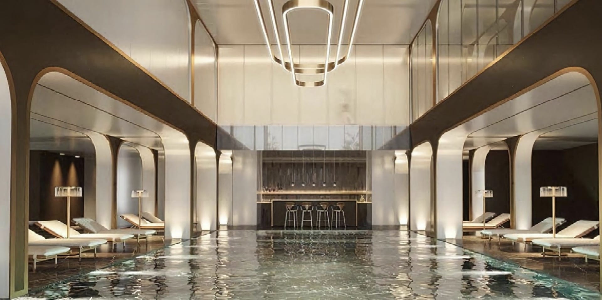Indoor pool with sun loungers and a bar counter at the Breza hotel, Kolašin, Montenegro: modern interior design.