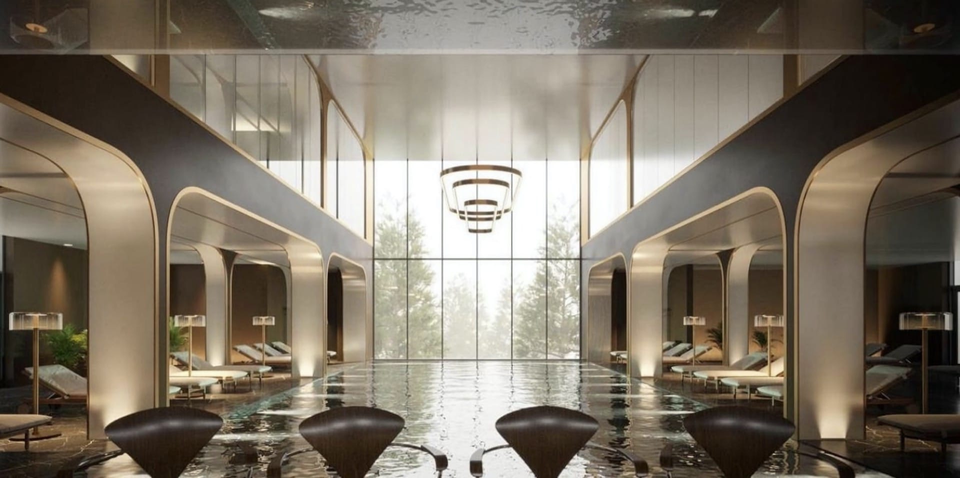 Indoor pool at the Breza Hotel, Kolašin, Montenegro: modern interior, panoramic windows, and a relaxation area with loungers.