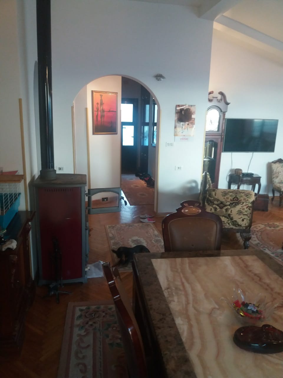 Living room with a fireplace, marble table, and classic furniture in a house, the town of Muo, Montenegro.