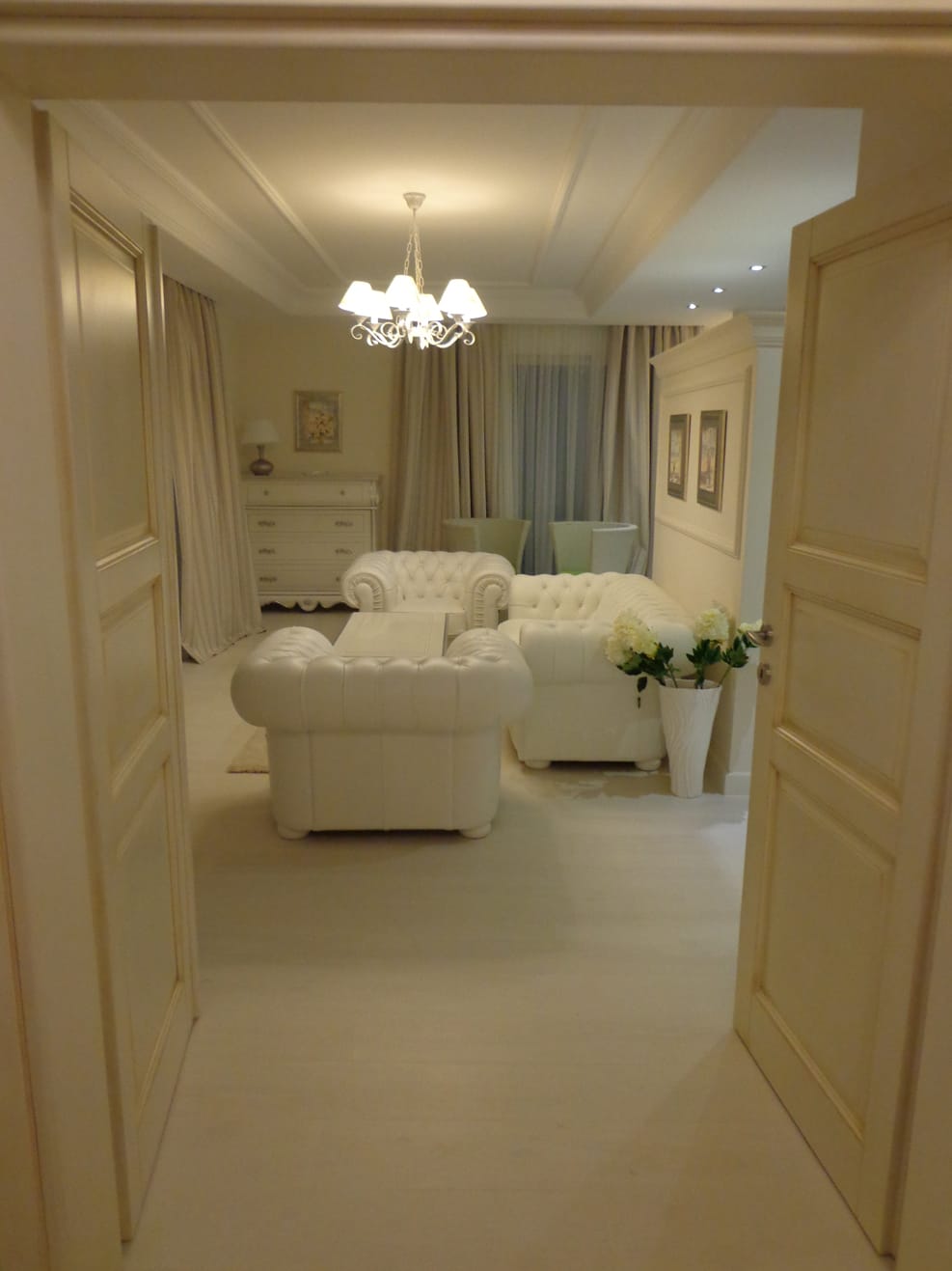 Living room with white leather furniture in a classic style in a villa in Dobra Voda, Montenegro.