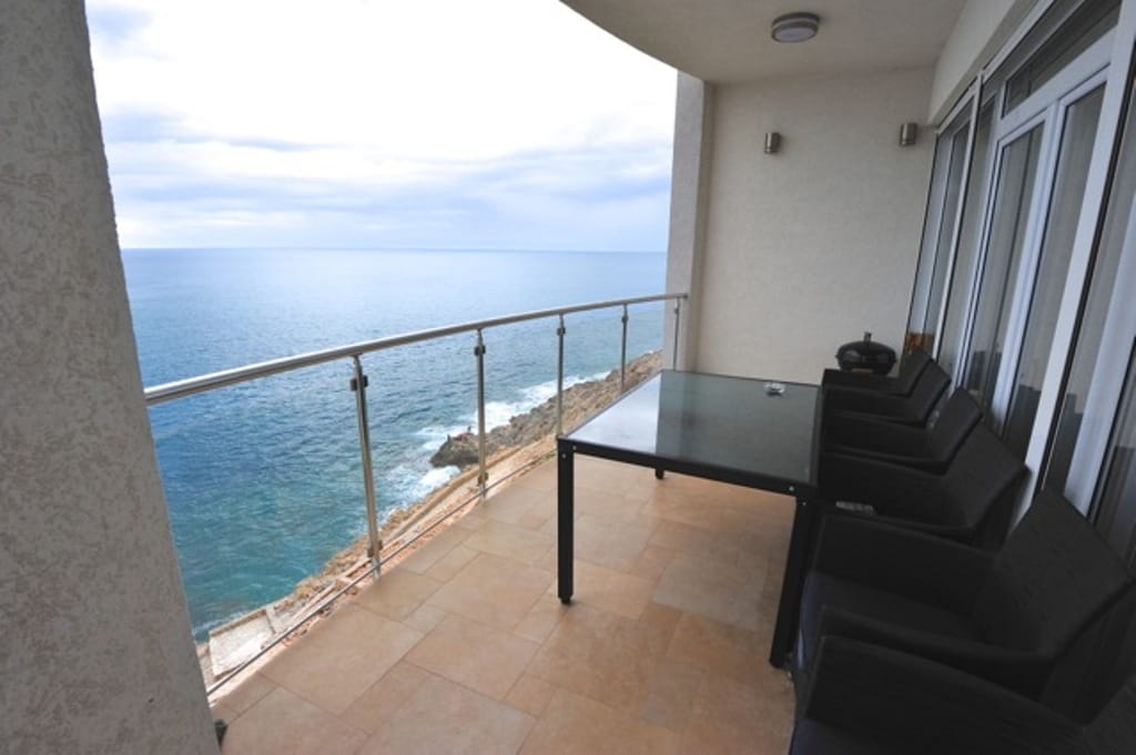 Terrace with furniture and panoramic sea view in the apartment, Dobrota, Montenegro.