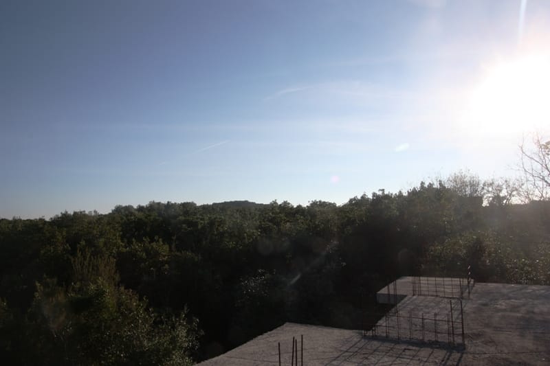 View of a green forested area from a building plot in Krymovitsa, Montenegro.