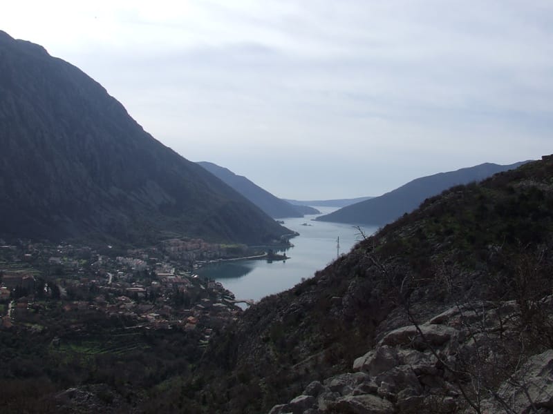 Panoramic view of the Bay of Kotor and the town of Risan in Montenegro from a hillside plot of land.