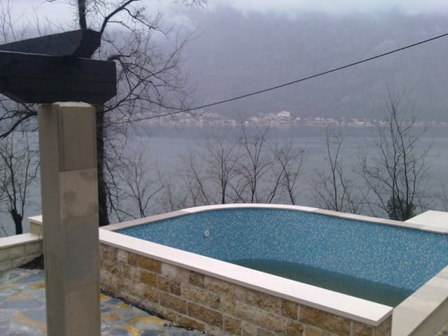 Outdoor pool with mosaic finish and views of Kotor Bay, house in Prčanj, Montenegro.