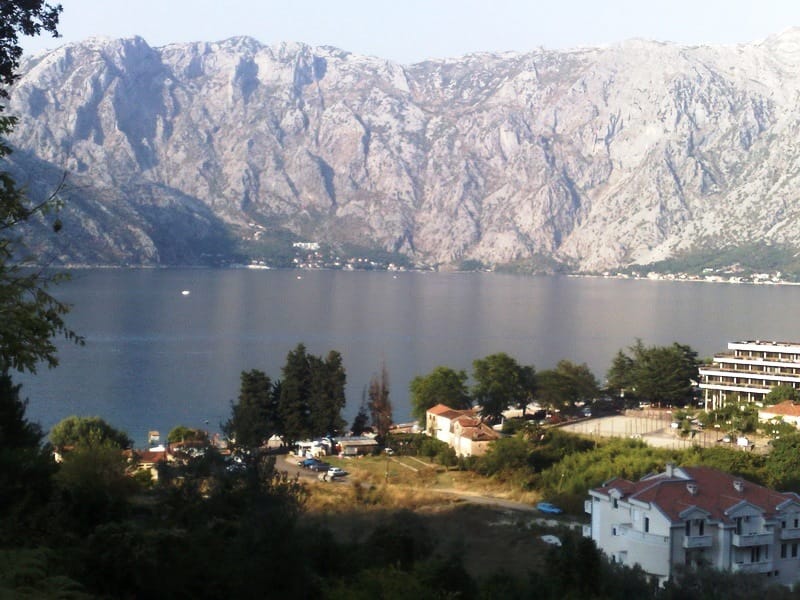 Panoramic view of Kotor Bay and the mountains from a plot of land in Stoliv, Montenegro.