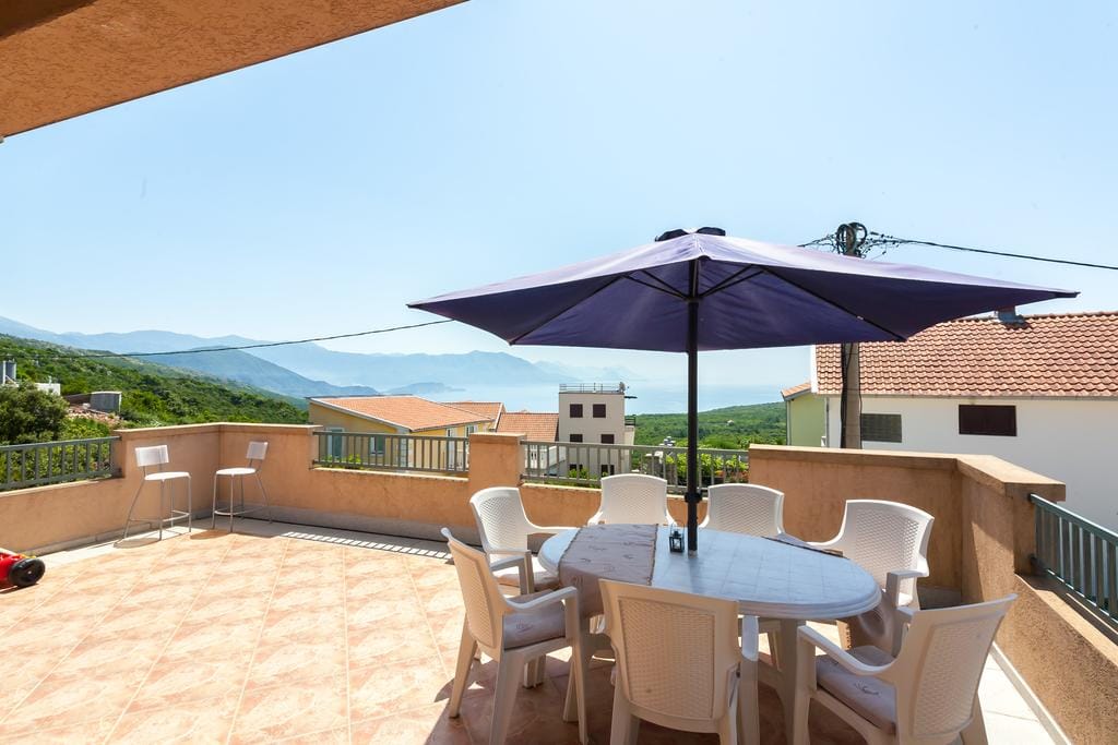 Spacious terrace with a dining area and sea view in the house, Krimovica, Montenegro.