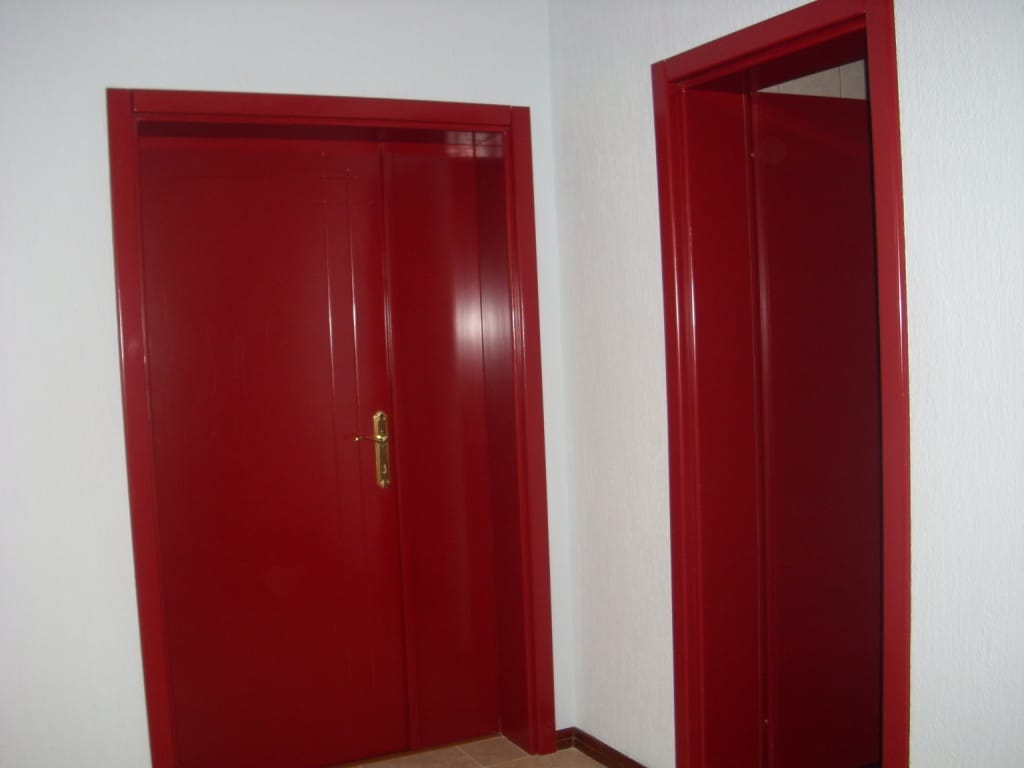 Bright red interior doors in the interior of a villa in Markovichi, Montenegro. Modern room finishes.