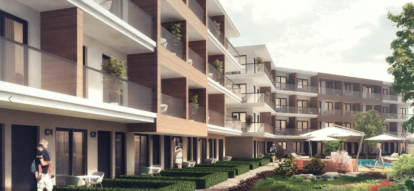Modern residential complex in Kavac, Montenegro: facade with terraces, landscaping, and an outdoor swimming pool.