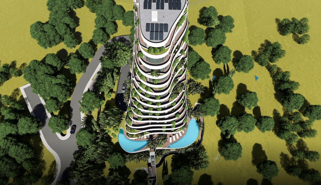 Top view of a modern residential complex in Rafailovići, Montenegro: terraces with greenery and an outdoor pool.