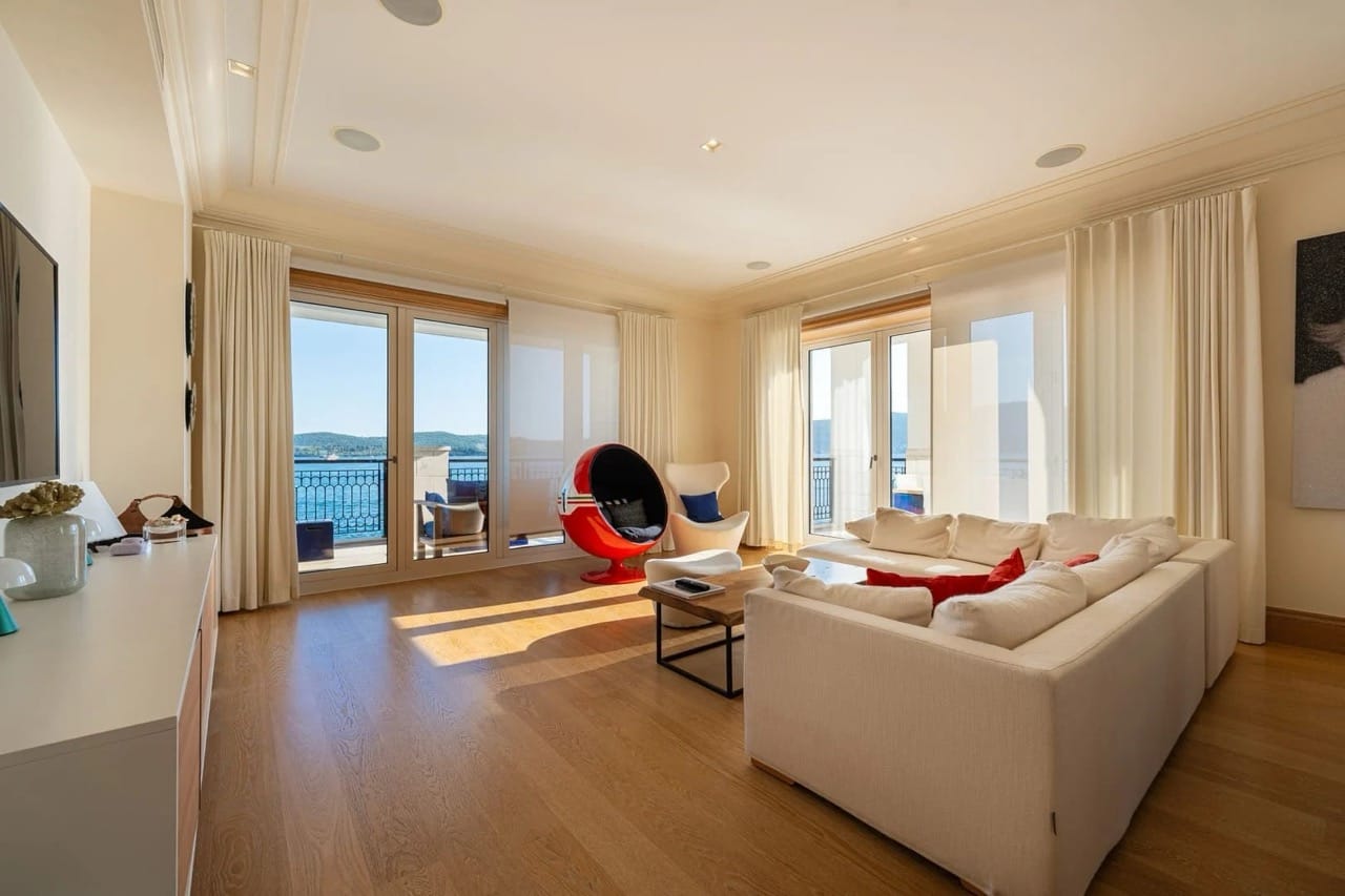 Living room in an apartment in Porto Montenegro, Tivat, Montenegro: bright interior, panoramic sea view, and terrace.