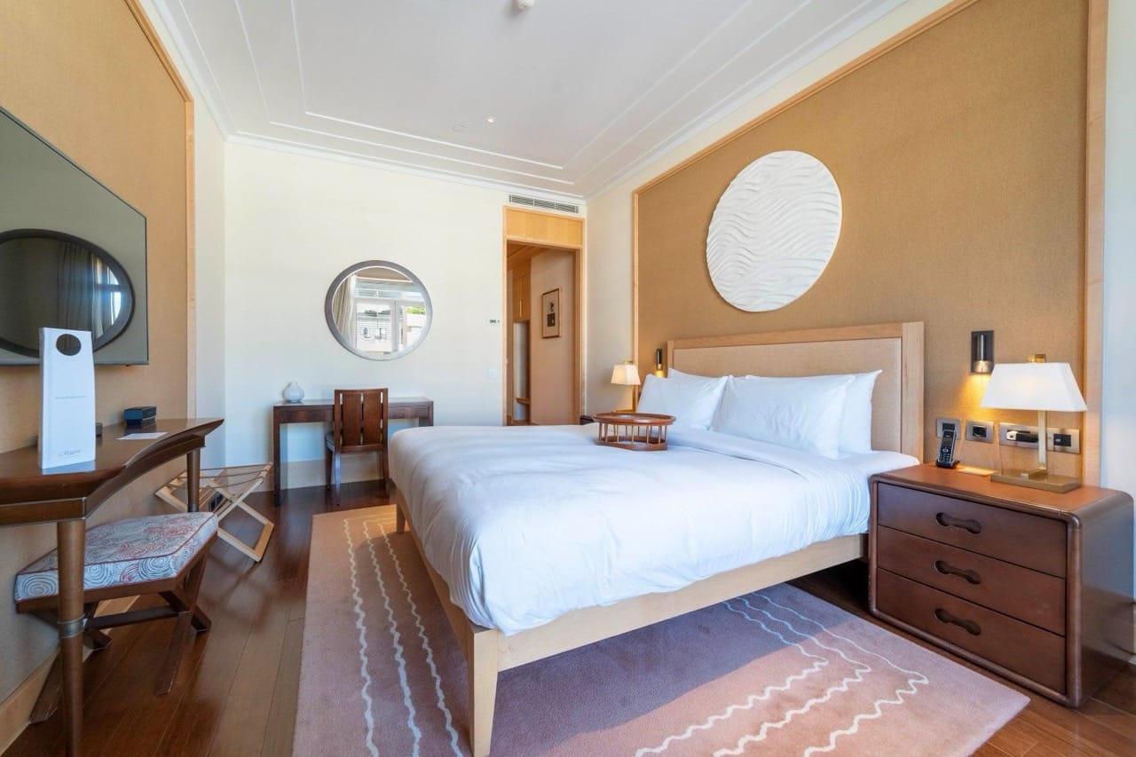 Bedroom in an apartment in Porto Montenegro, Tivat, Montenegro: double bed, wooden furniture, and stylish interior.