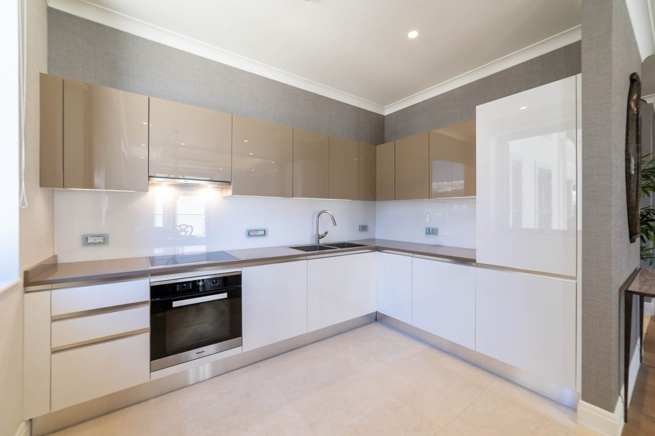 Modern kitchen with glossy fronts and Miele appliances in an apartment in Portonovi, Kumbor, Montenegro.