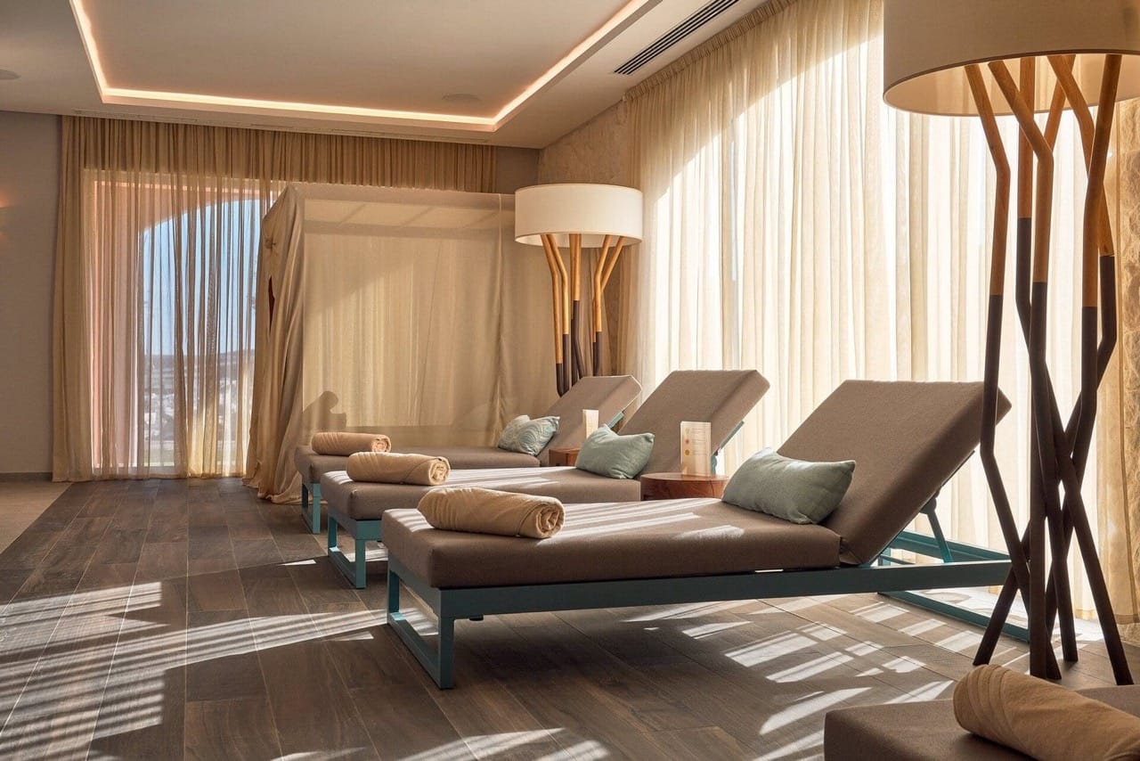 Relaxation area with sun loungers in the spa center of Lustica Bay apartments, Radovici, Montenegro: stylish interior and decor.