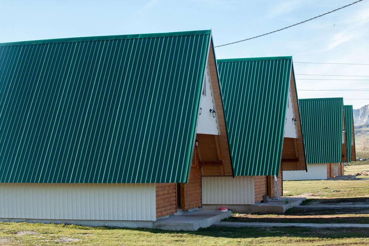 Modern wooden cottages with green roofs in a mountain complex, Žabljak, Montenegro.