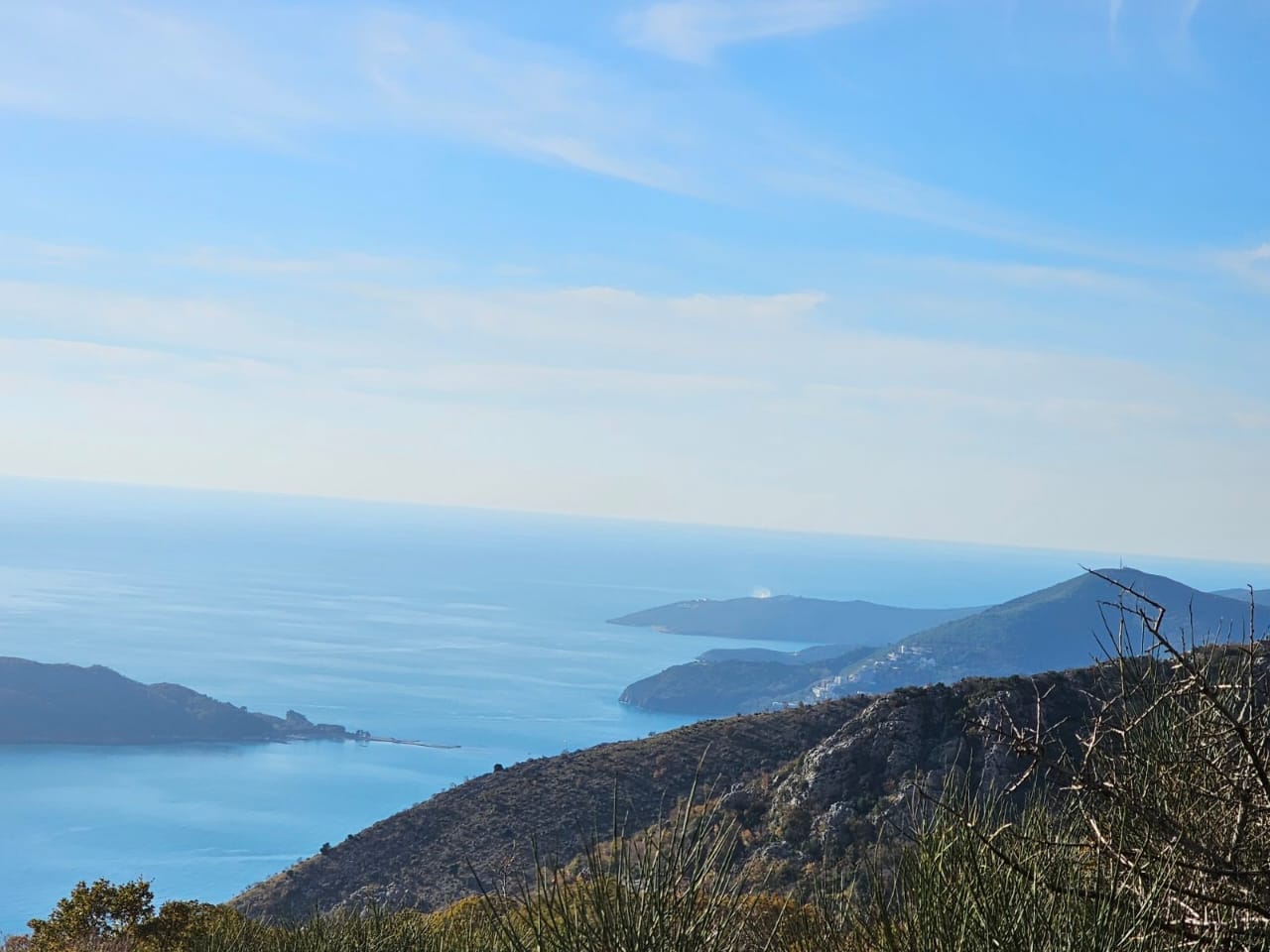 Panoramic view of the Adriatic Sea and mountains from a plot of land in Kuljača, Budva Riviera, Montenegro.