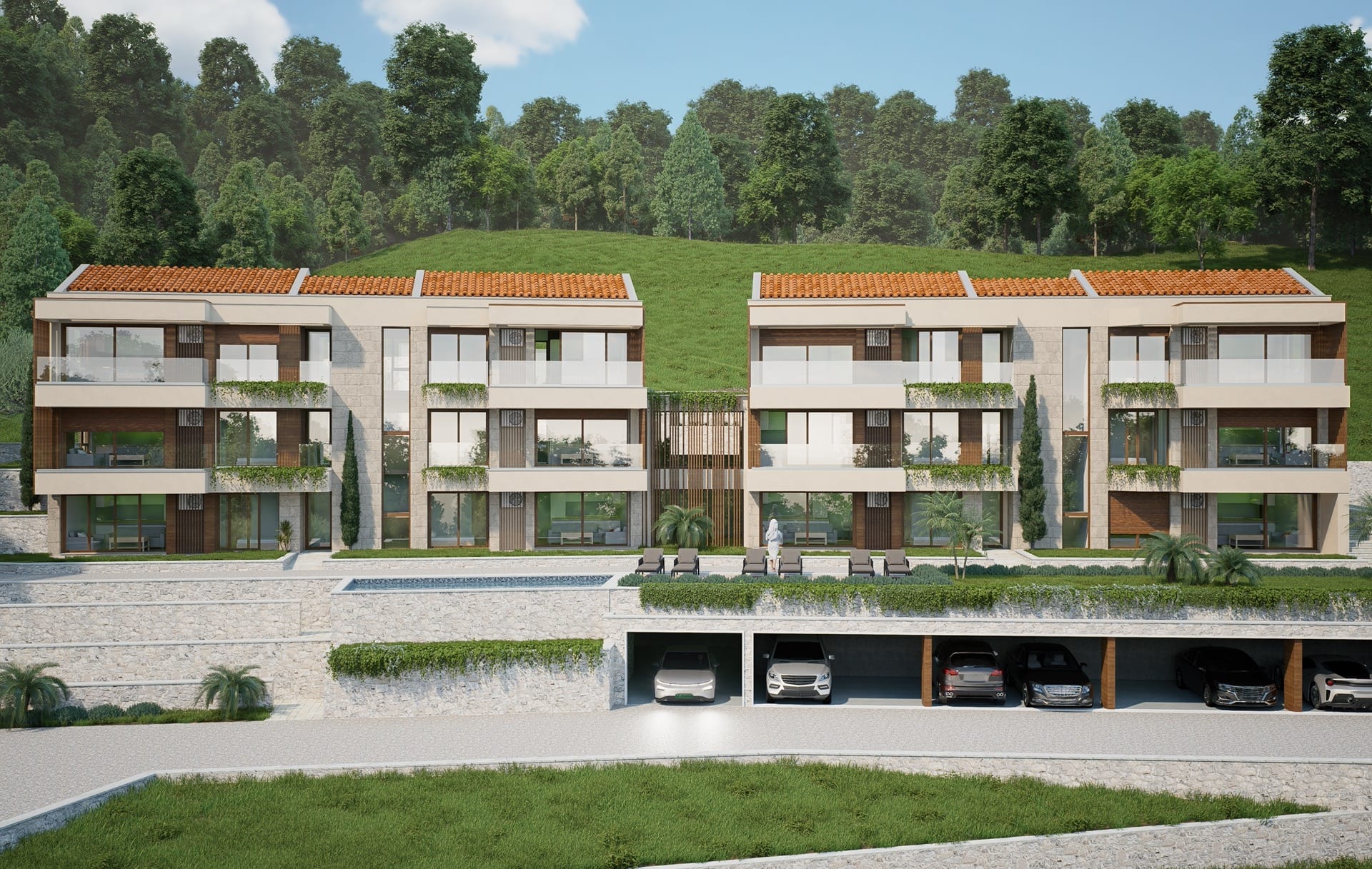 Modern residential complex with a pool and parking in Blizikuće, Montenegro: view of the building facades with terraces.