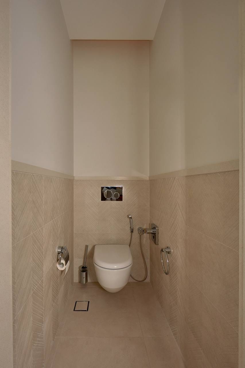 Modern bathroom with a wall-mounted toilet and bidet shower in an apartment, Porto Montenegro, Tivat, Montenegro