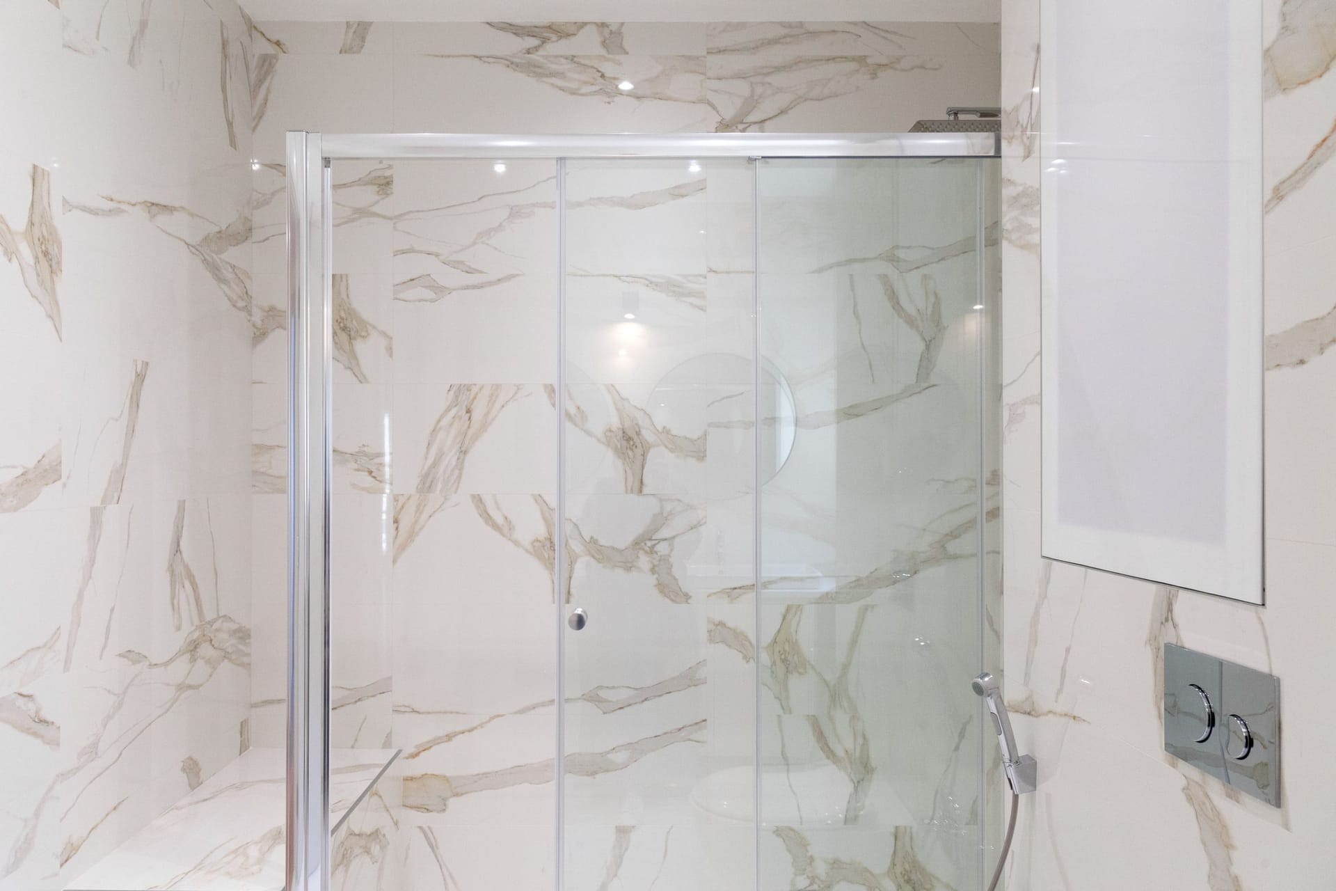 Modern bathroom with a shower cabin and marble-style finishes in an apartment, Kotor, Montenegro