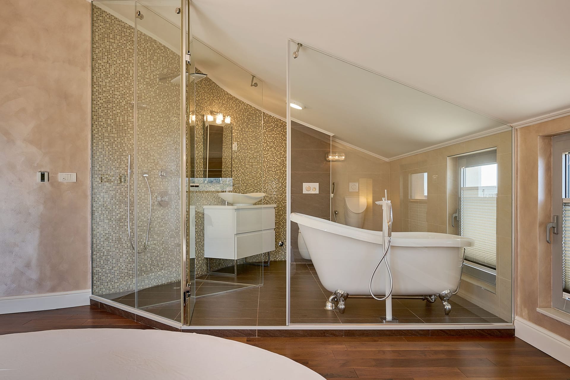 Modern bathroom with a freestanding bathtub and glass shower in an apartment in Budva, Montenegro.