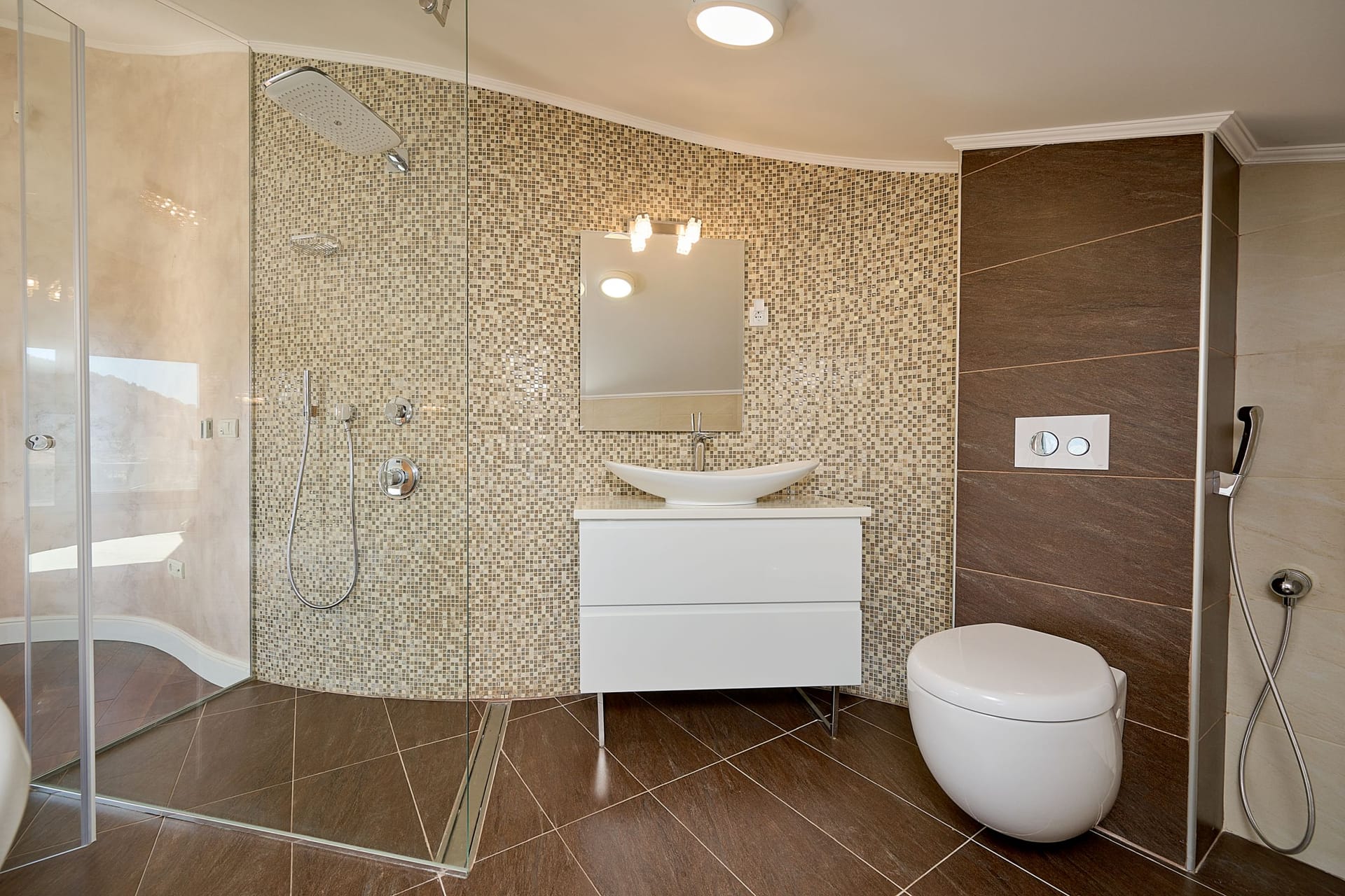 Modern bathroom with a shower cabin and mosaic finishes in an apartment in Budva, Montenegro.