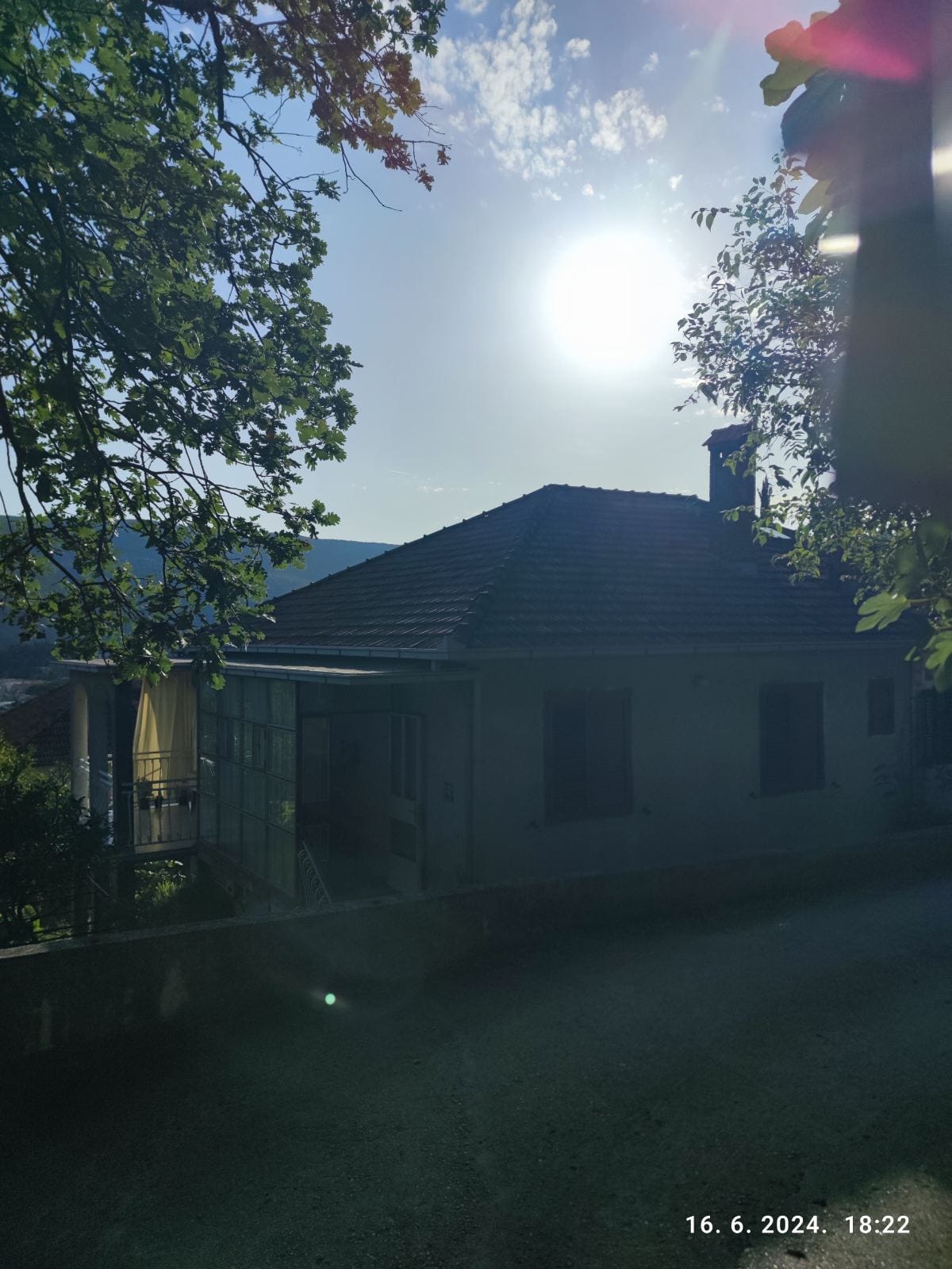 Private house with a terrace and tiled roof surrounded by greenery, Igalo, Montenegro — exterior view of property No. 2398