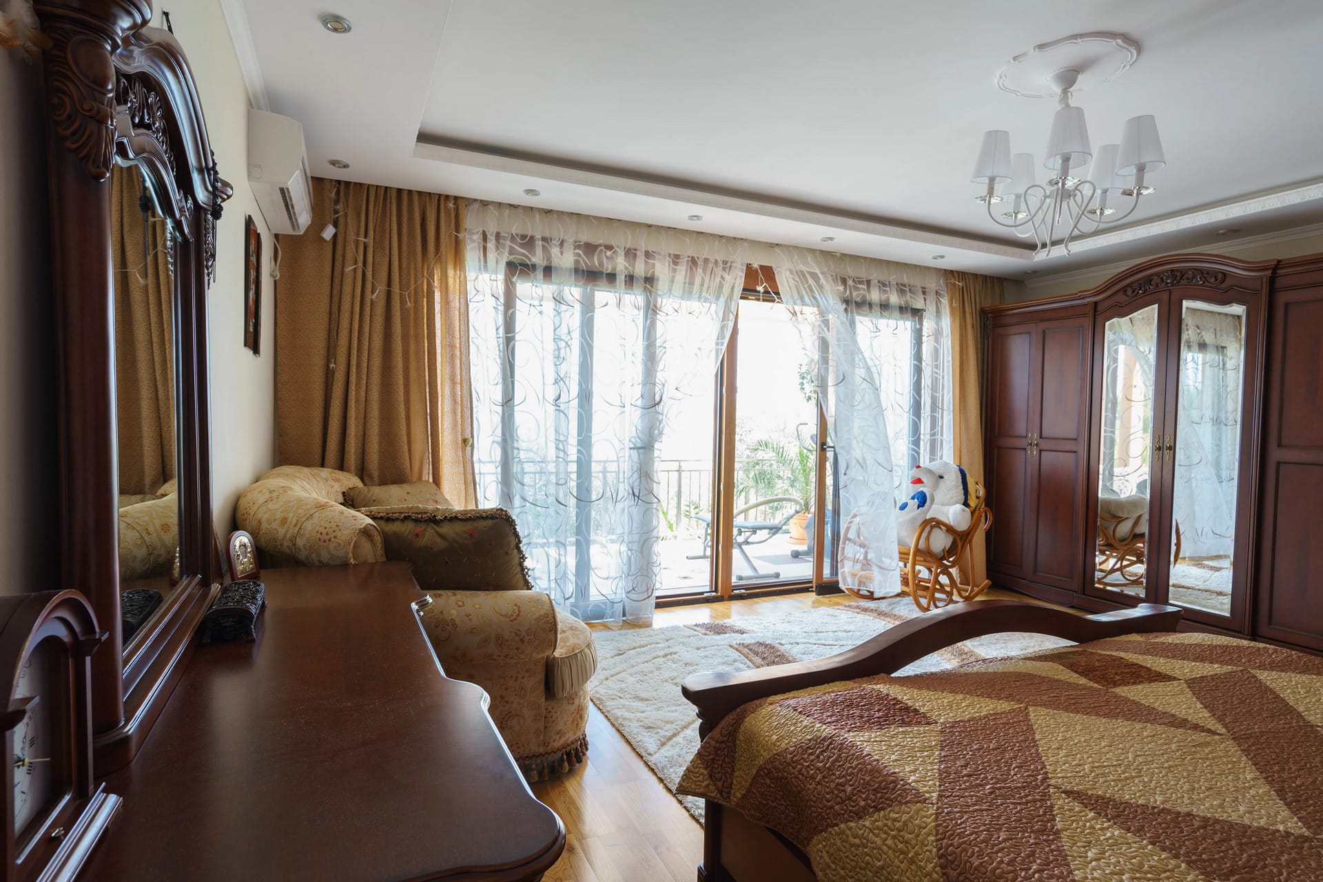 Bedroom with classic furniture and access to the terrace in a house, Sutomore, Montenegro.