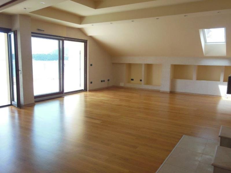 Spacious attic living room with panoramic access to the terrace and sea view in Rafailovici, Montenegro.