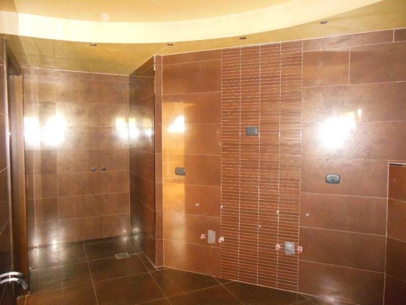 Modern bathroom with brown tile finishes in an apartment, Rafailovići, Montenegro.