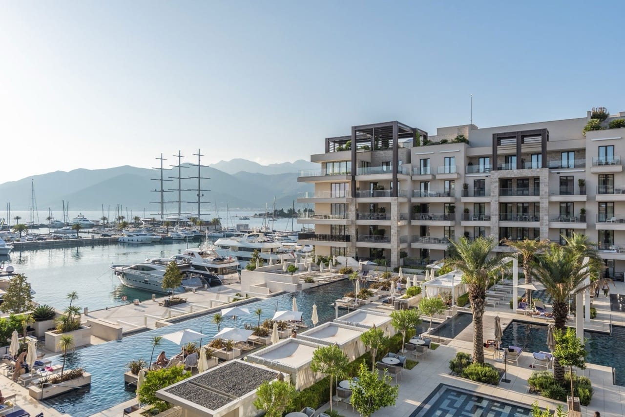 View of the pool and Porto Montenegro yacht marina in Tivat, Montenegro: a modern residential complex with terraces.