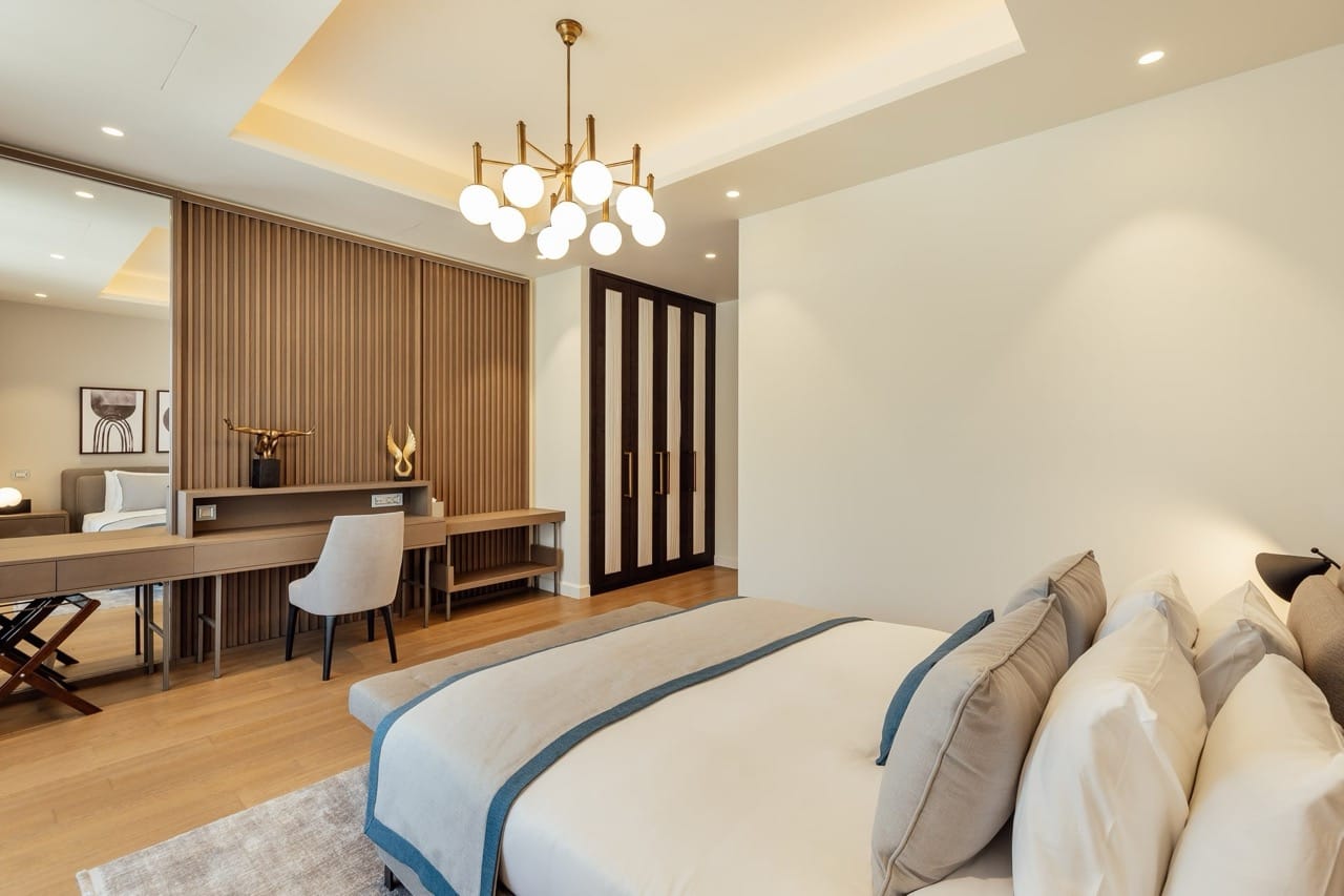 Modern bedroom in an apartment in Portonovi, Kumbor, Montenegro: designer furniture, slatted wall finish, and stylish decor.