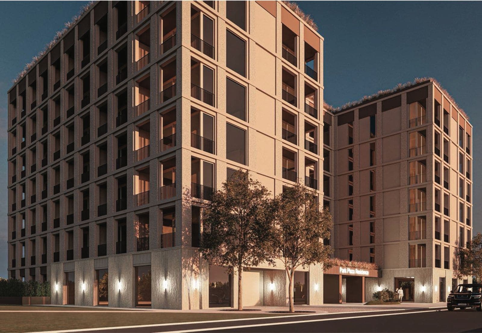 Современный жилой комплекс Park Plaza Residence в Будве, Черногория: фасад здания с панорамными окнами и подсветкой.