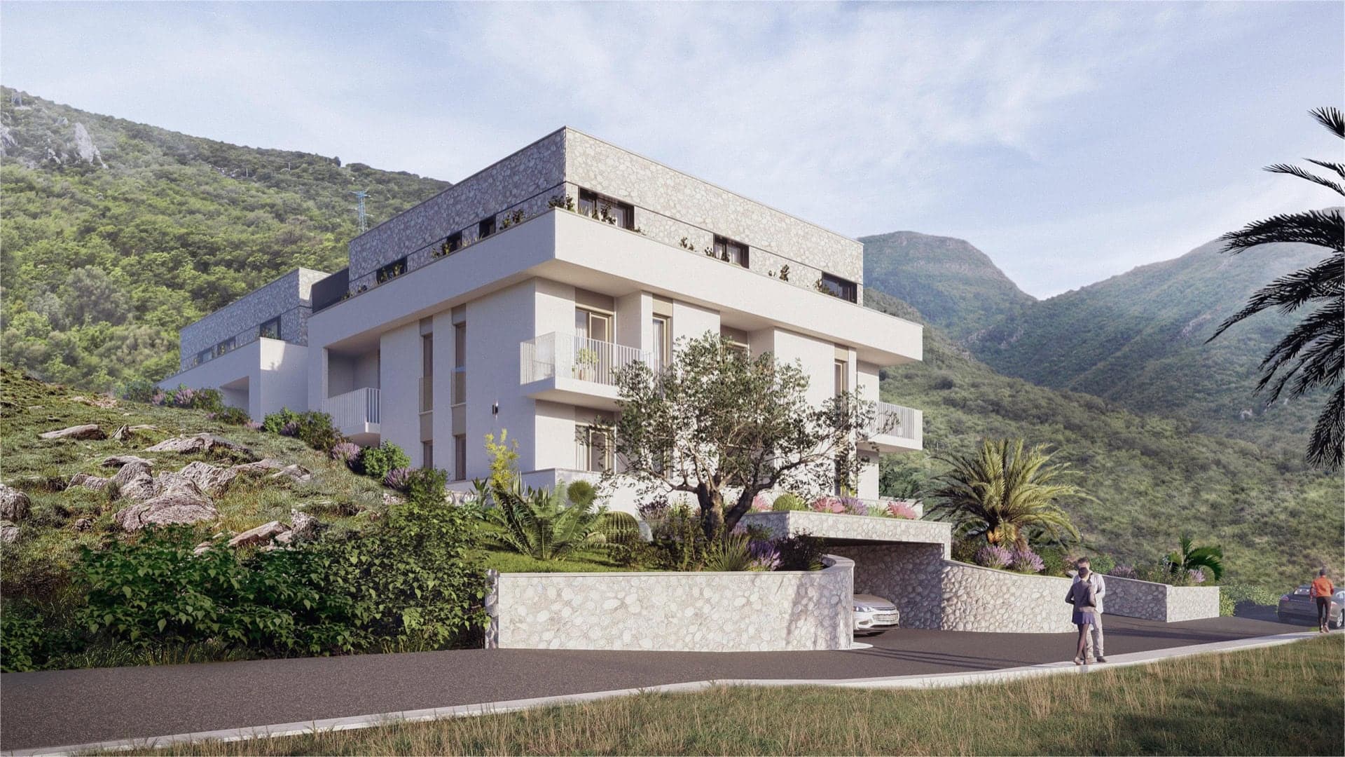 Современный жилой комплекс с отделкой камнем в горах Котора, Черногория: вид на здание с террасами и парковкой.