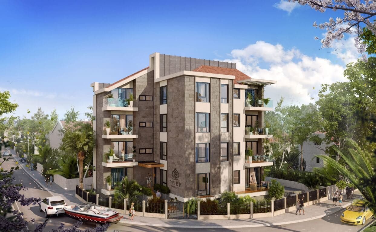 Современный жилой комплекс Park Residence в Тивате, Черногория: фасад с каменной отделкой и балконами.