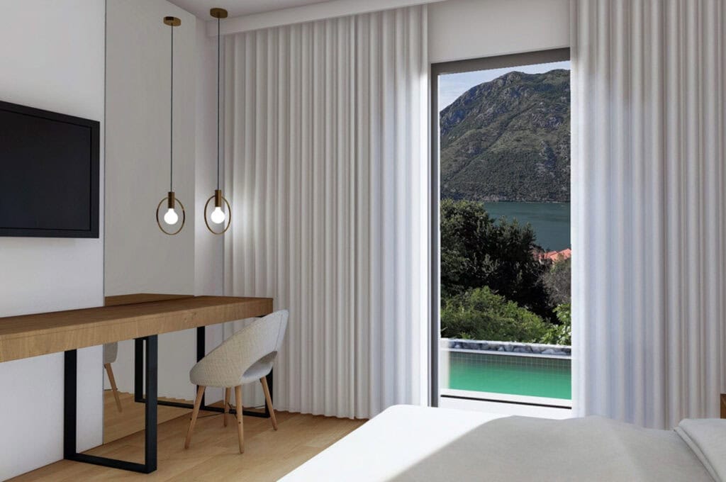 Modern bedroom in an apartment in Stoliv, Montenegro: mountain and sea view, desk, panoramic window, and pool.