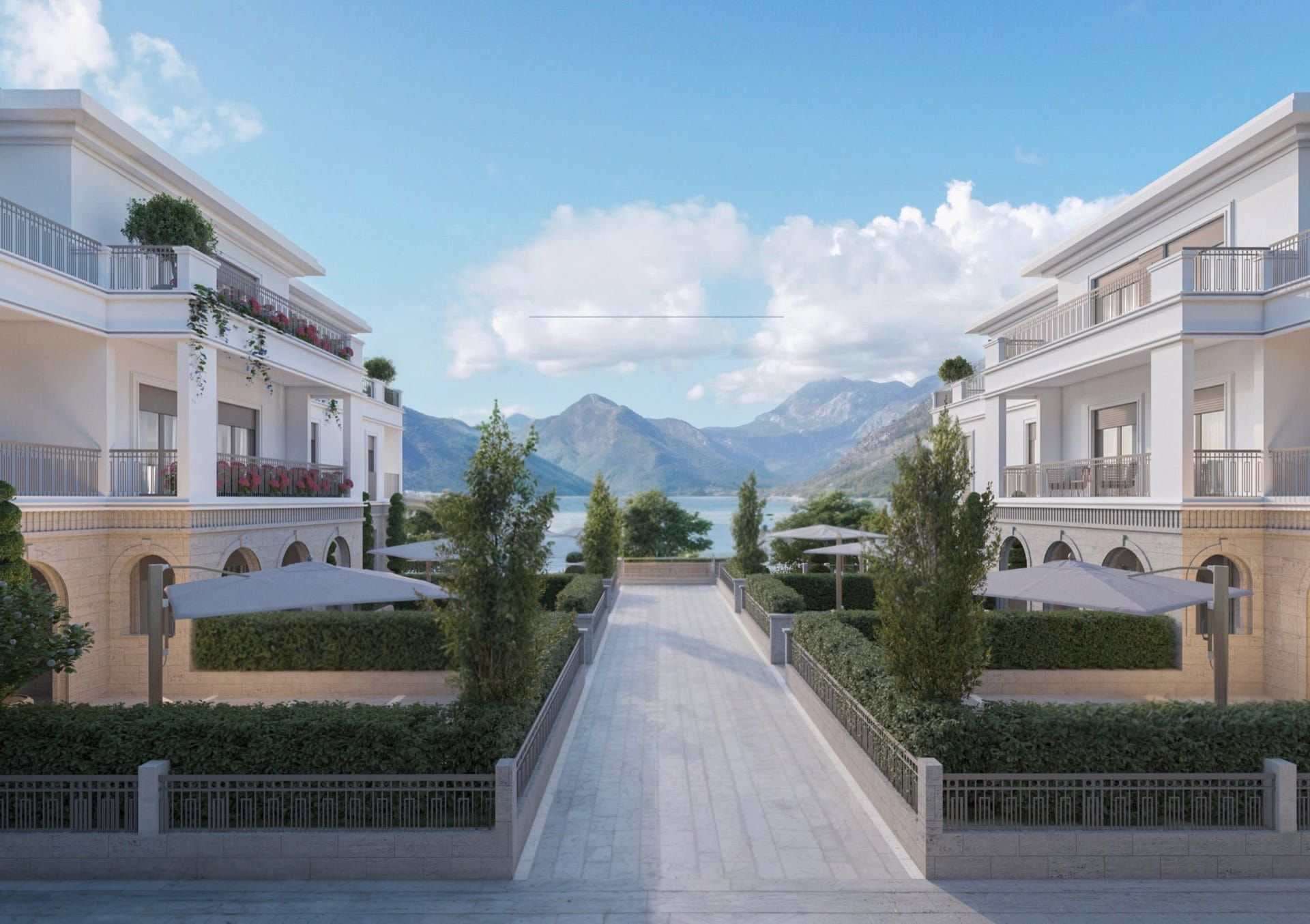 Residential complex in Luštica, Montenegro: modern villas with terraces, landscaped grounds, and mountain and sea views.