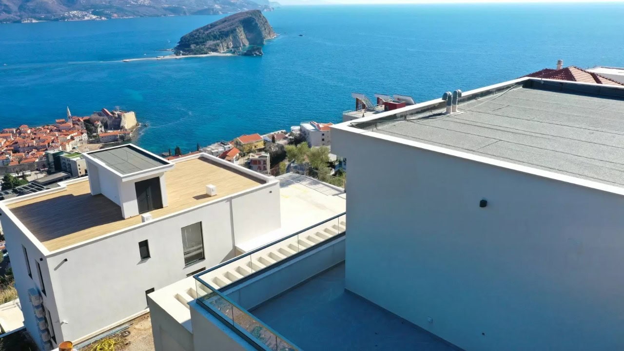 Modern villa in Budva, Montenegro: panoramic view of the sea, St. Nicholas Island, and the city from the house terrace.