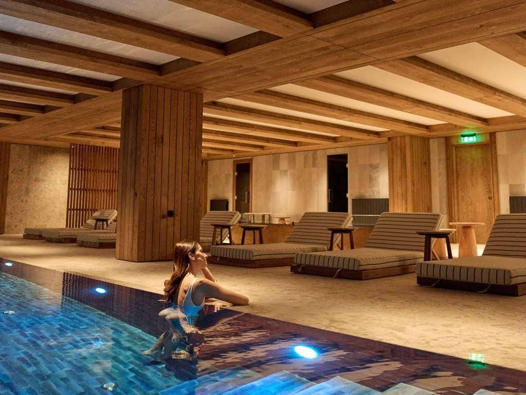 Indoor pool and spa area with wood finishes in a residential complex, Kolašin, Montenegro.